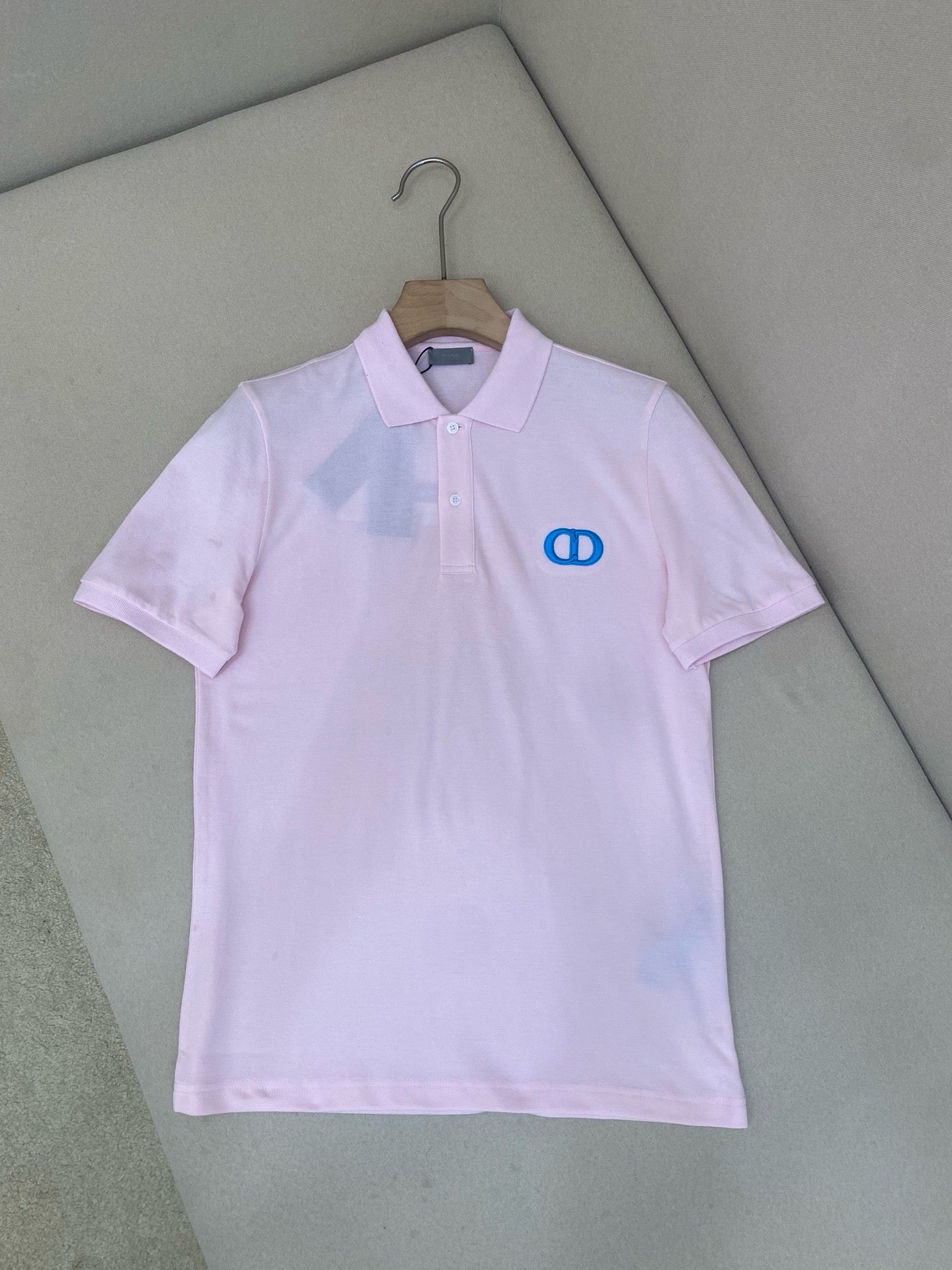 Rosa Baumwoll-Poloshirt mit CD-Symbol